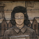 A frieze depicts an imprisoned schoolgirl at the Japanese American Exclusion Memorial on Bainbridge Island